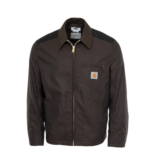 Image 1 of 3 - BLACK - JUNYA WATANABE X CARHARTT Stripe Oxford Jacket featuring collar, pinstripes, zip front closure, logo patch at chest, 3 front pockets, adjustable button tab at cuffs and locker loop at back collar. 100% polyester. Made in Japan. 
