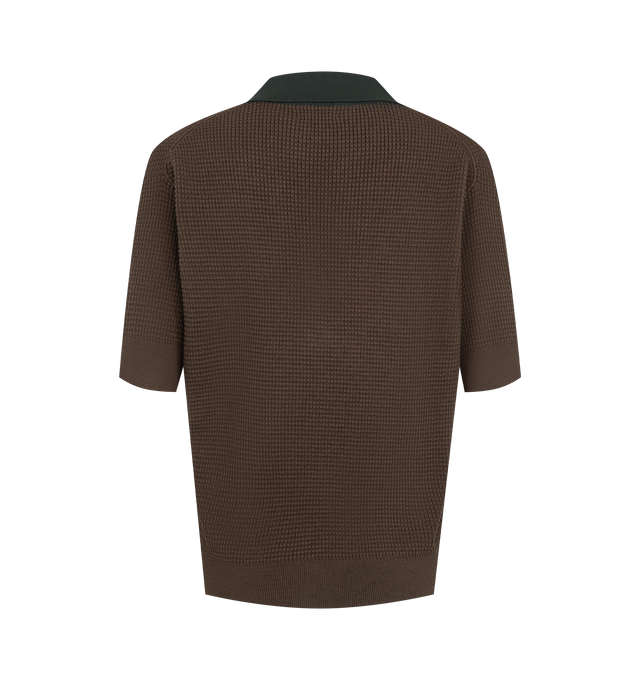 Image 2 of 2 - BROWN - JW Anderson Women's Knitted Polo Top is crafted from a lightweight cotton, cashmere, and polyamide blend and features a short-sleeve silhouette in a textured waffle stitch knit. Designed with a tonal collar and placket, button-front detailing, and a signature loop detail inspired by the brand's tipped bomber jacket for a refined yet contemporary finish. Main Material: 88% Cotton, 9% Cashmere, 3% Polyamide. Made in Italy. 