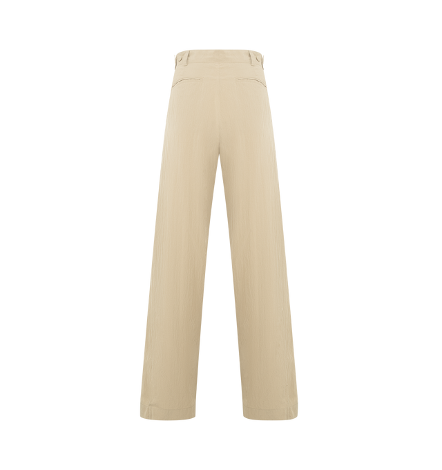 Image 2 of 3 - NEUTRAL - THE ROW Iven Pant featuring tailored low-rise pant in softly crinkled technical silk with barrel leg, front double pleats, adjustable back button tabs and side welt pockets. 65% silk, 35% nylon. Made in Italy. 