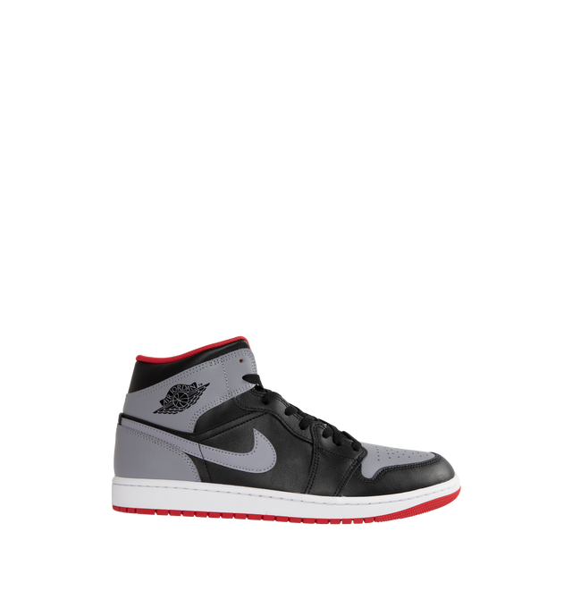 Image 1 of 5 - MULTI - AIR JORDAN 1 MID are grey, black and red sneakers made from a premium leather and synthetic upper which provides durability, comfort and support. These sneakers have an air-sole unit in the heel that delivers signature cushioning as well as has a rubber outsole that offers traction on a variety of surfaces. 