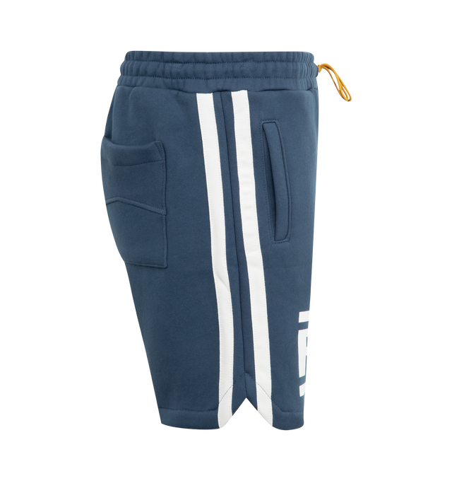 Image 3 of 3 - NAVY - Rhude Champions Shorts have an elastic drawstring waist, large signature graphics, side pockets, and a back patch pocket.  