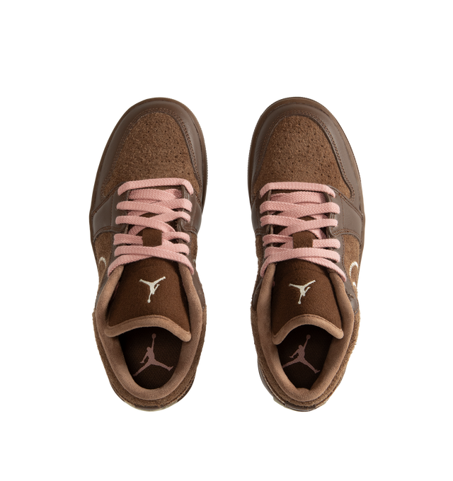 Image 5 of 5 - BROWN - Air Jordan 1 Low SE Women's Shoes pair the timeless design of the original AJ1 with premium materials and everyday comfort. Crafted with a genuine leather upper, this low-top silhouette is designed with Nike Air cushioning and a foam midsole for lightweight support, while a durable rubber outsole provides reliable traction. Main Material: Genuine Leather Upper. Cushioning: Nike Air Technology with Foam Midsole. Outsole: Rubber. 
