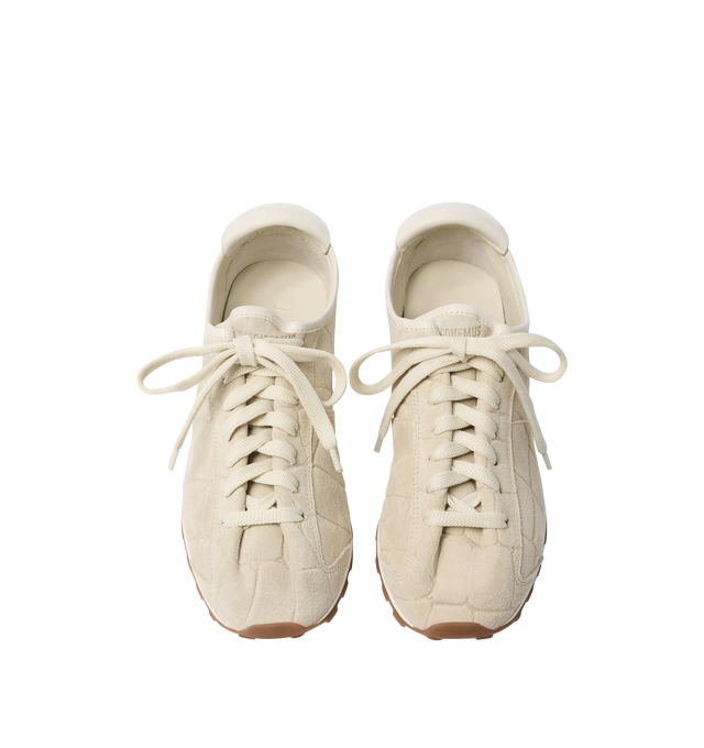 Image 4 of 4 - WHITE - JACQUEMUS Tennis Sneaker featuring soft sneakers in soft crocodile-embossed suede, almond-shaped toe, flat laces, embossed logo on the tongue, embossed logo on the heel tab, removable leather-covered insole and rubber outsole in a round and square shape. 100% calf leather. Outsole: 100% thermoplastic polyurethane. Made in Portugal. 
