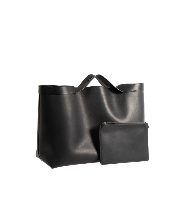 Image 2 of 3 - BLACK - The Row Women's Large Kit Tote Bag is crafted from finely grained calfskin leather and features a structured silhouette with a flat base, continuous leather trim, and integrated top handles. Designed for everyday versatility, this spacious carryall is fully lined in calfskin leather and includes a removable zip pouch for added organization. Main Material: 100% Calfskin Leather. Lining: 100% Calfskin Leather. Dimensions: 15.75 x 11.02 x 5.51 in. Handles: Built-In Leather Handles. Inter 