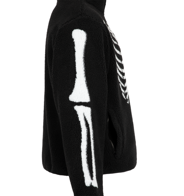 Image 3 of 3 - BLACK - The Men's Skeletal Quarter Zip Sherpa Pullover Jacket is constructed from 100% polyester sherpa with a coordinating polyester lining. The pullover silhouette features a quarter-zip closure and contrasting skeletal artwork across the body and sleeves. Material: 100% Polyester 