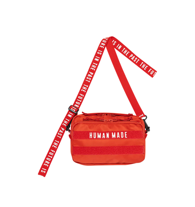 Image 2 of 4 - RED - Human Made horizontal military pouch crafted from durable nylon. Adjustable, detachable shoulder strap allows it to be worn diagonally (cross-body). Removing the magic tape on the front reveals text, adding a playful touch. Features dual front 3D pockets featuring logo text and webbing loops, zip pocket at back, sleeve pocket at interior and zip closure at top. Measures 14 cm high x  22cm wide x 4cm deep. 100% nylon. Made in Japan. 