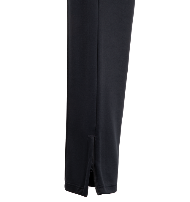 Image 4 of 4 - NAVY - Carhartt WIP Men's Bolon Sweat Pant is crafted from midweight polycotton interlock and features a loose fit, adjustable elasticated waistband, embroidered graphic lettering, and zip openings at the leg hems. Designed for everyday comfort and utility, it is finished with zip welt pockets at the sides and a zip back pocket. Main Material: 64% Polyester, 36% Cotton Interlock.  