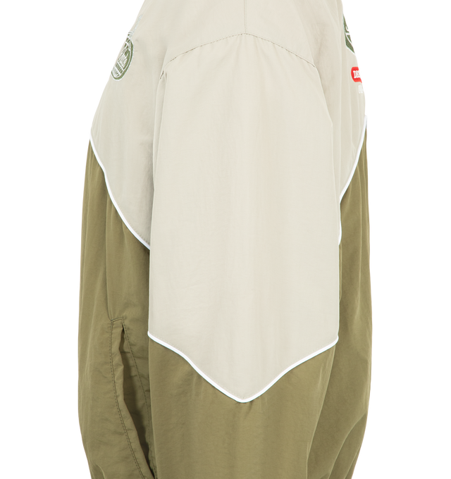 Image 3 of 3 - GREEN - Rhude Desert Racing Track Jacket is crafted from nylon and features a sport-inspired silhouette designed with racing influences. Detailed with graphic branding, a full-zip front, and functional pockets, the jacket combines technical construction with elevated everyday wear. Main Material: 100% Nylon. Lining: 100% Polyester. Made in USA. 