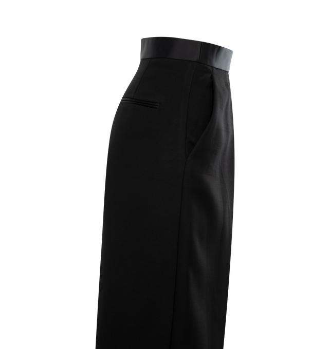Image 3 of 3 - BLACK - KHAITE Marine Pant featuring design to sit lower on the waist, this refined trouser is shaped by sharp, angled pleats and a bold zipper. Clean waistband in satin suiting. 75% viscose, 25% polyamide. 
