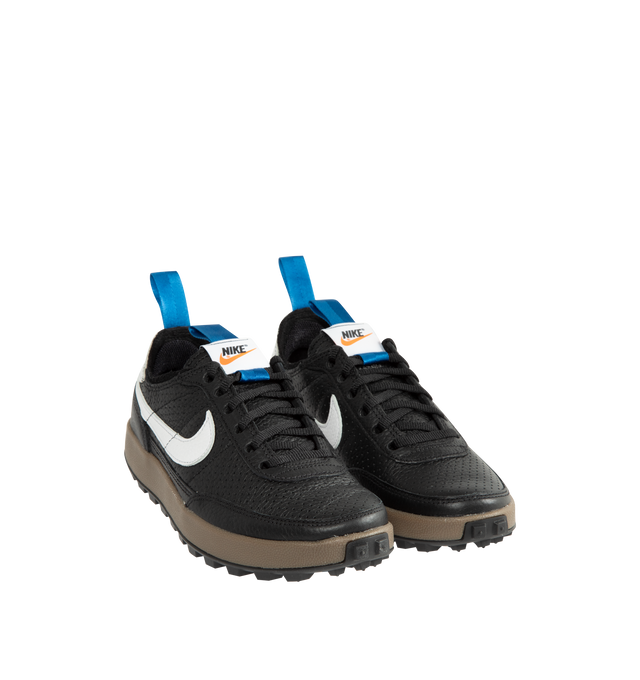 Image 2 of 5 - BLACK - Tom Sachs x Nike Unisex NikeCraft General Purpose Shoe "Demerits" is crafted from durable leather and features a low-profile silhouette inspired by everyday utility and wearability. Designed with blue nylon herringbone pull straps, a premium microfiber collar, and an embroidered "NIKE" logo in Tom Sachs' handwriting at the heel, this edition references the designer's "Demerits" concept. Main Material: Leather Upper. Collar: Premium Microfiber. Midsole: Gum Rubber with EVA Foam C 