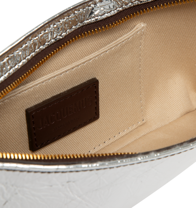 Image 3 of 3 - SILVER - Jacquemus Le Bisou Perle Shoulder Bag has a zipper closure, an adjustable buckle leather strap, bead details, metal hardwate, and an interior patch pocket. 100% cowskin. Made in Italy. 