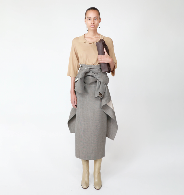 Image 4 of 4 - BROWN - THE ROW Laz Skirt featuring knotted detailing at the hip, mid-rise, back center slit, back zip closure, full length and falls straight from hip to hem. Wool/nylon/polyamide. Lining: silk. Made in Italy. 