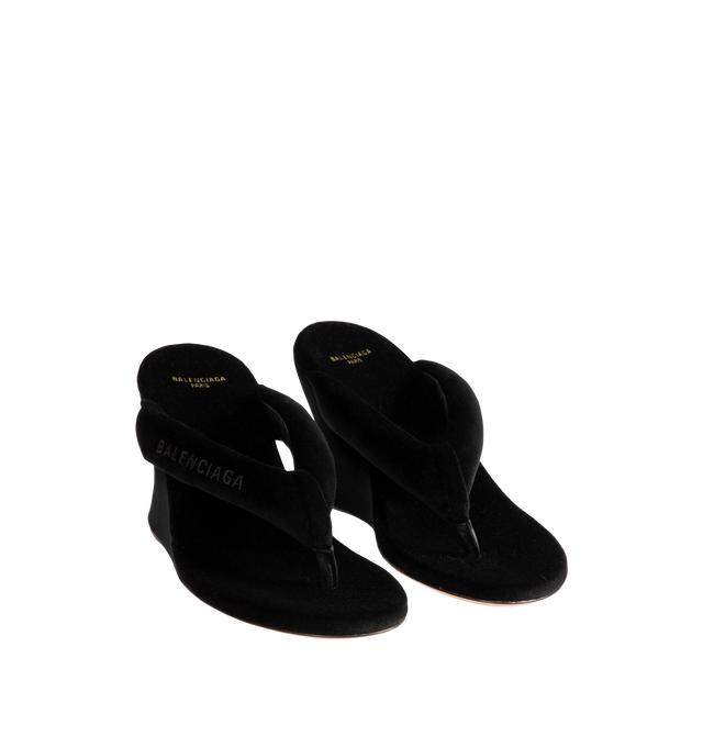 Image 2 of 4 - BLACK - Balenciaga Womens Gaeta Wedge Thong Sandals are crafted from a plush stretch velvet material. Feature a round toe, padded thong strap, slip-on design, 90mm arch wedge heel, and leather sole. Upper: cotton, viscose, elastane, Sole: calfskin, Insole: cotton, viscose, elastane. Made in Italy. 