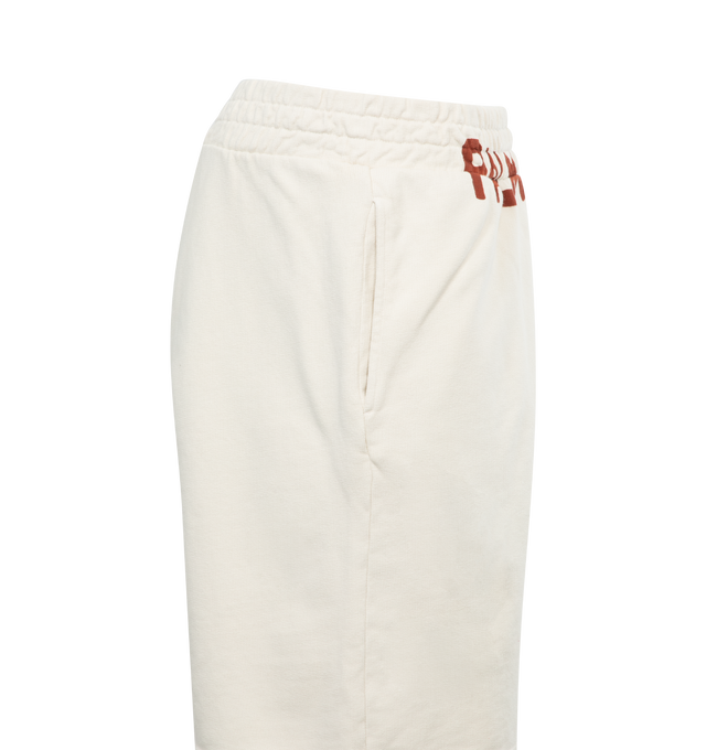 Image 3 of 3 - WHITE - PALM ANGELS Men's butter-colored sweat shorts with vertical pockets and red Palm Angels lettering printed below the elastic waistband at the front. 100% cotton.  