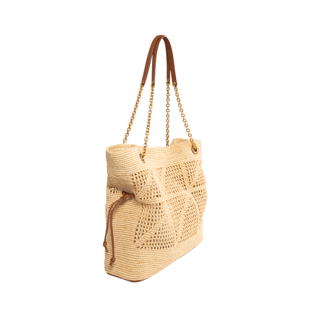Image 2 of 3 - NEUTRAL - SAINT LAURENT Jamie Shopping Bag in Raffia featuring the cassandre, a chain strap, drawstring ties allow the sides to be cinched or expanded to create different silhouettes, bronze-tone hardware and magnetic closure. 13.8" x 13.8" x 3.9". Strap drop: 12.6". Raffia. Made in Madagascar. 