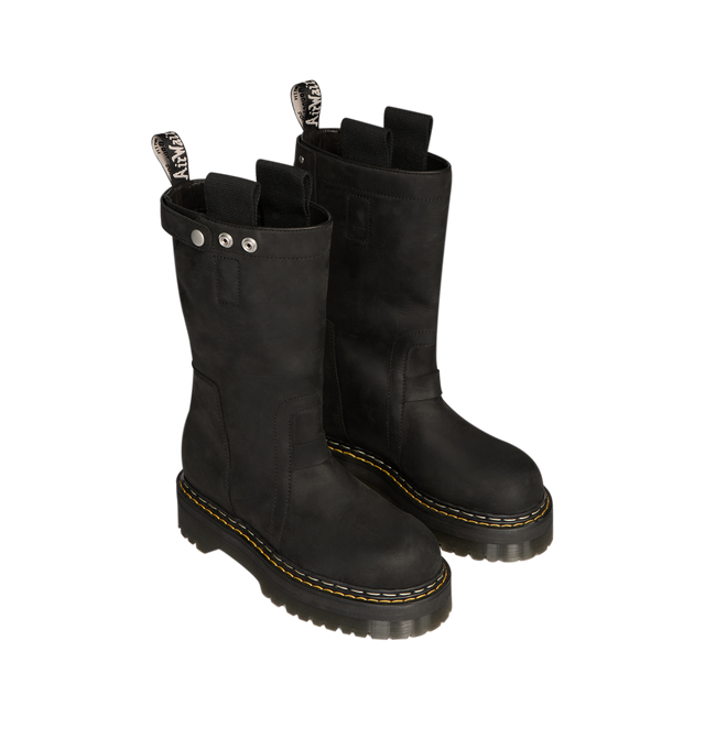 Image 3 of 7 - BLACK - Dr. Martens x Rick Owens FW26 Quad Sole Pull On Boot in Nubuck Leather. These Women's Dr. Martens boots are reimagined by Rick Owens and are mid-calf height with a steel toe cap and palladium-finish hardware, including snaps and a side zipper. They feature a topstitched seam arcing over the front foot, a stitched heel counter, two side pull tabs, and a woven Dr. Martens AirWair heel loop in black and pearl. The boots are finished with a Quad sole and a yellow and pearl welt stitch. Th 