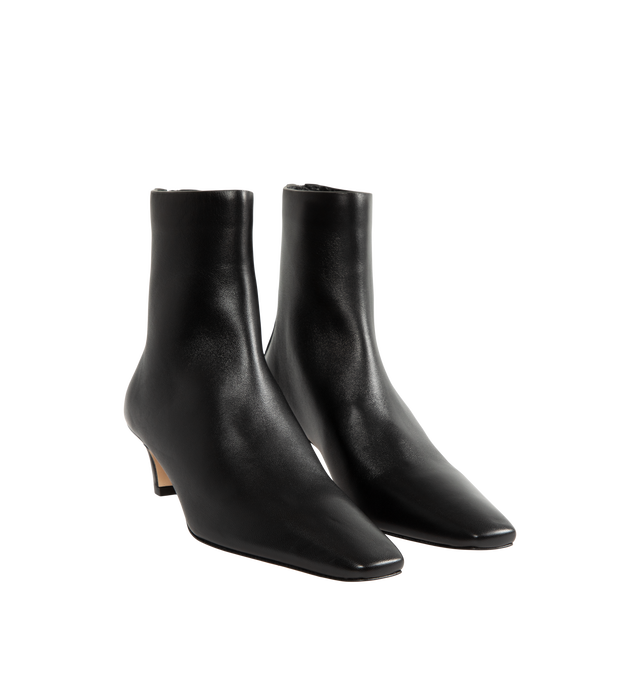 Image 2 of 4 - BLACK - Toteme Women's Nappa Mid Heel Boots are crafted from soft nappa leather and feature a minimalist, unlined construction for a second-skin fit. Designed with a sleek silhouette, they are finished with a squared pointed toe, a slanted 55mm heel, and a branded back zip fastening. Main Material: Goat Skin Leather. Lining: Sheepskin. Sole: Calf Leather. Heel Height: 55mm. Made in Italy. 