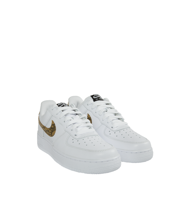 Image 2 of 5 - WHITE - Nike Air Force 1 Low Retro Premium 'Ivory Snake' in the coveted white, elemental gold, and dark hazel colorway. Features Nike Air cushioning, low-cut silhouette, padded collar, foam midsole, perforations on toe and rubber outsole. 