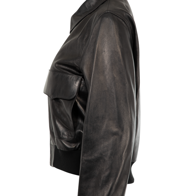 Image 3 of 3 - BLACK - NILI LOTAN Redley Leather Bomber Jacket featuring shrunken fit jacket in leather, patch front pocket with flaps, dual entry pockets, small shoulder, hidden snap closure, pointed collar, rib trim at hem and sleeve and blouson detail at back. 100% lambskin leather. 