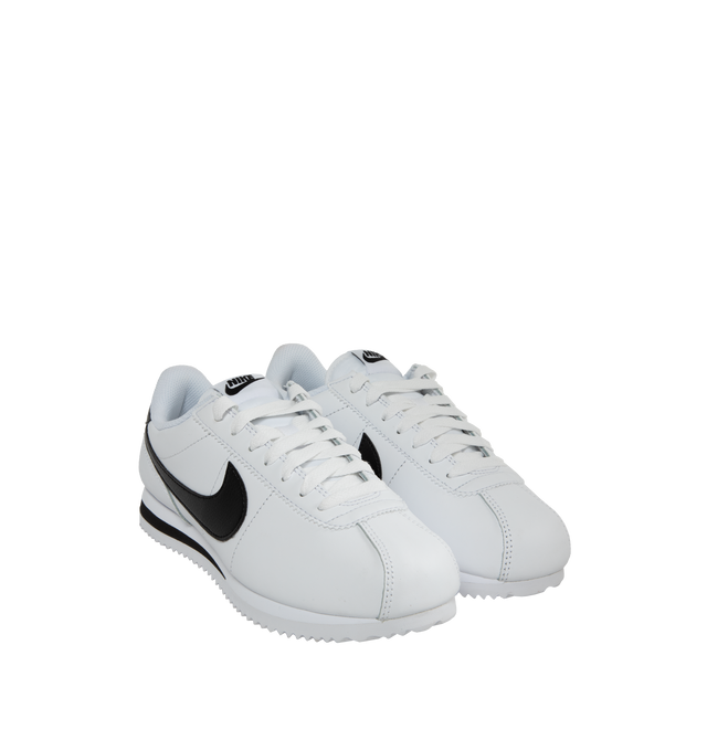 Image 2 of 5 - WHITE - NIKE CORTEZ leather lace-up sneaker featuring foam midsole, wedge insert, leather upper, rubber sole with herringbone pattern and a padded, low-cut collar. 