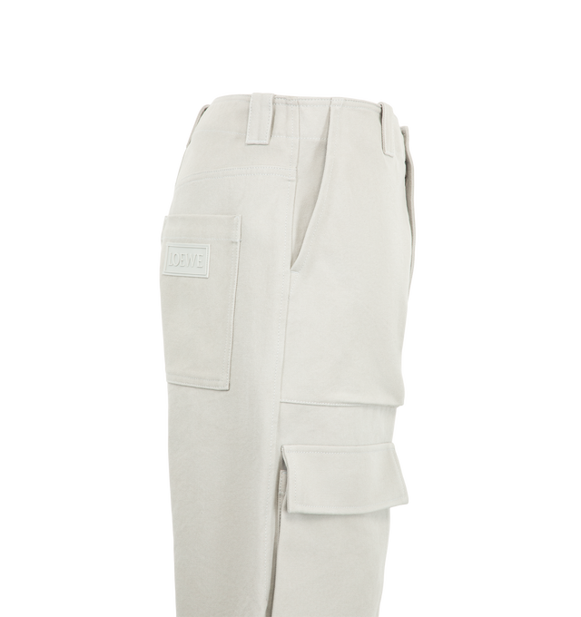 Image 3 of 3 - GREY - Loewe Men's Cargo Trousers are crafted from medium-weight grey cotton canvas and feature a regular fit with a mid-rise waist, straight leg, and regular length. Wire-trimmed flap pockets, slash pockets, rear patch pockets, a hammer loop, and a concealed zip fly define the utility-inspired design, while a Loewe rubber patch accents the rear pocket. Main Material: Cotton. Made in Italy. 