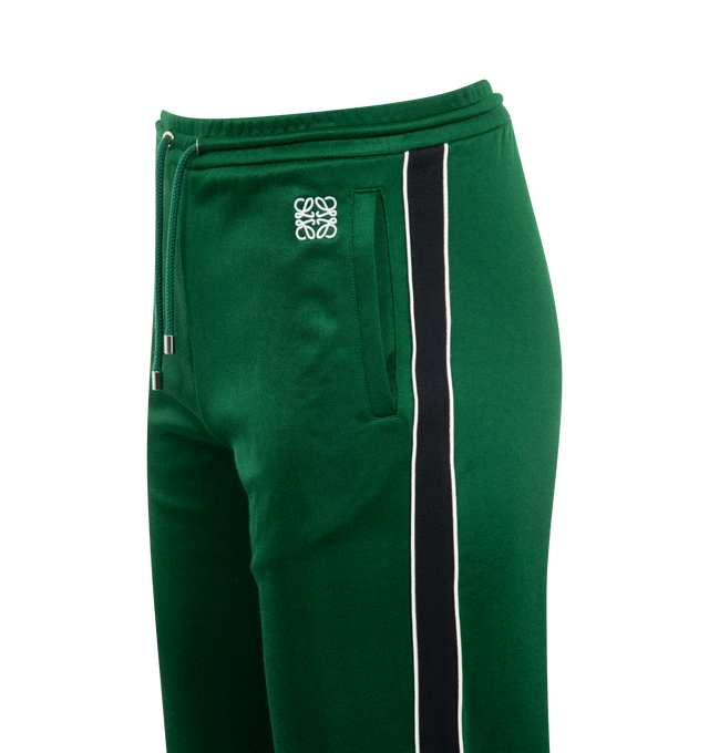 Image 3 of 4 - GREEN - Loewe Trousers crafted in lightweight technical jersey in a relaxed fit and regular length with mid waist and straight leg. Features elasticated waistband with drawstring, zipped welt pockets, zipped rear welt pocket, herringbone side tape and Anagram embroidery placed at the front. Polyester/Cotton. Made in Portugal.  