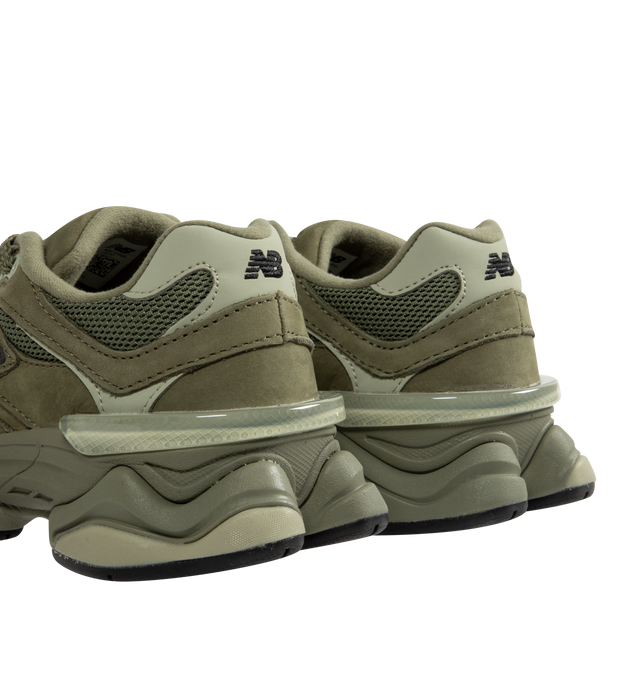 Image 3 of 5 - GREEN - New Balance 9060 Sneakers are a lace-up style with pigskin and mesh details, dual-density midsoles with ABZORB and SBS cushioning, translucent CR devices at the heels, and diamond pattern outsoles.  