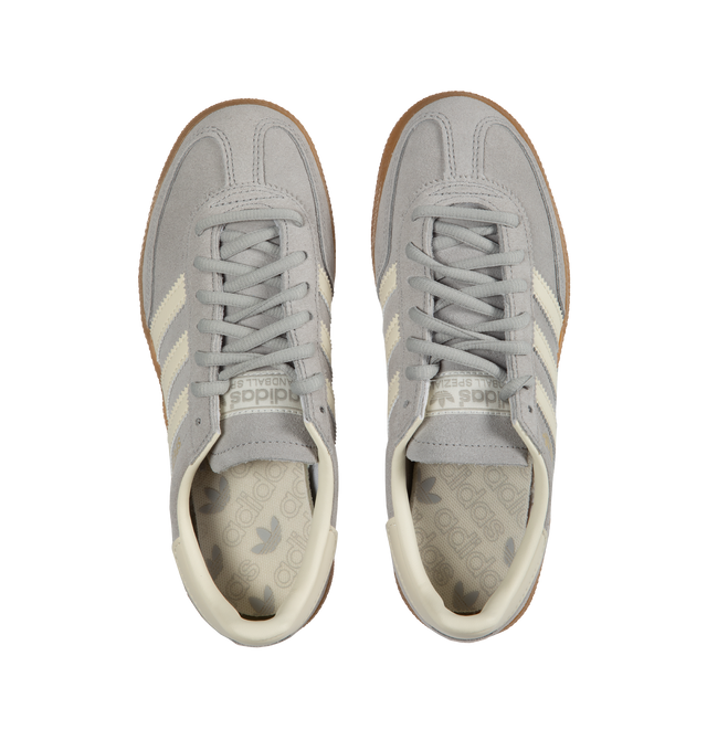 Image 5 of 5 - GREY - Adidas Originals Handball Spezial lace-up sneakers with premium smooth silver-color suede and leather upper featuring off-white tri-stripes, Spezial tongue logo, metallic signature on the side and gum rubber outsole. 