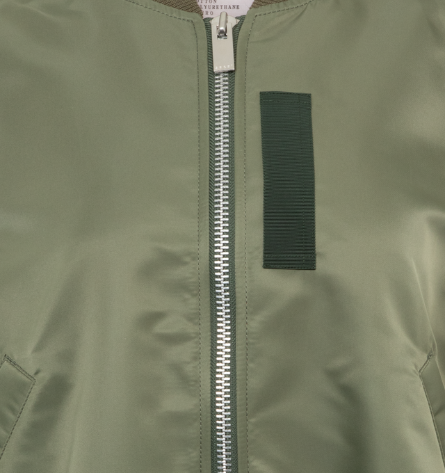 Image 3 of 3 - GREEN - SACAI Nylon Twill Blouson featuring grosgrain-trimmed pleated shell, ribbed collar, hem and cuffs and two-way zip fastening through front. 100% nylon. 