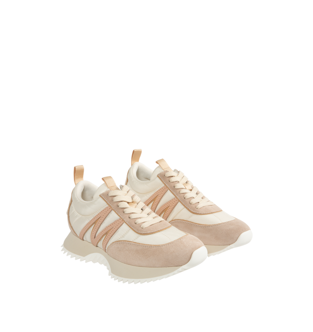 Image 2 of 5 - NEUTRAL - Moncler Pacey Low Top Sneakers are a lace-up style with round toes, flat heels, debossed tongue logos, and rubber outsoles. Made in Italy.  