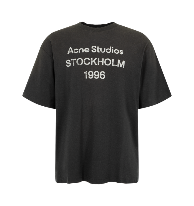 Image 1 of 2 - BLACK - Acne Studios Men's Sprayed Logo T-Shirt is crafted from an organic cotton and hemp blend jersey with an irregular surface and features a relaxed unisex silhouette with a hip-length fit. Designed with a vintage-inspired sprayed finish, distressed ribbed trim, and the signature Acne Studios 1996 stamp logo at the front for a worn-in aesthetic. Main Material: 85% Organic Cotton, 15% True Hemp. 