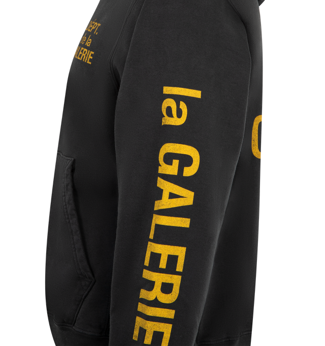 Image 3 of 4 - BLACK - GALLERY DEPT De La Galerie Sweatshirt featuring hooded neckline, logo print on front, back and sleeves, kangaroo pocket, long sleeves, ribbed cuffs and hem and pullover style. Cotton. Made in USA. 