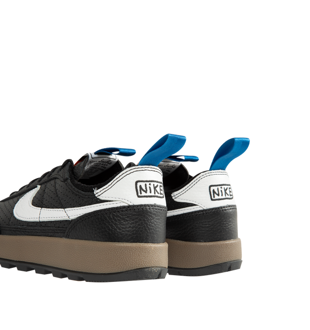 Image 3 of 5 - BLACK - Tom Sachs x Nike Unisex NikeCraft General Purpose Shoe "Demerits" is crafted from durable leather and features a low-profile silhouette inspired by everyday utility and wearability. Designed with blue nylon herringbone pull straps, a premium microfiber collar, and an embroidered "NIKE" logo in Tom Sachs' handwriting at the heel, this edition references the designer's "Demerits" concept. Main Material: Leather Upper. Collar: Premium Microfiber. Midsole: Gum Rubber with EVA Foam C 