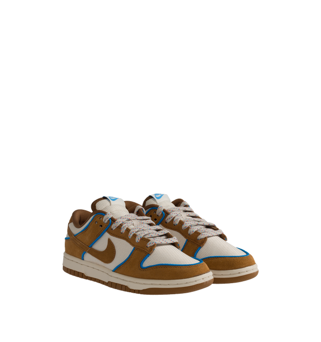 Image 2 of 5 - BROWN - NIKE Dunk Low Retro Premium in "British Tan" featuring padded, low-cut collar, aged upper, foam midsole and rubber outsole with classic hoops pivot circle. 