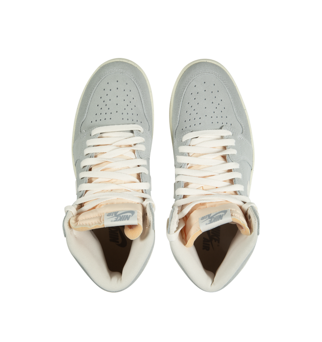 Image 5 of 5 - MULTI - NIKE AIR JORDAN 1 RETRO HIGH OG CRAFT IVORY features a real and synthetic leather in upper, encapsulated Nike Air unit, rubber in the outsole, wings logo on collar, embroidered Swoosh logo and Jumpman on tongue. 