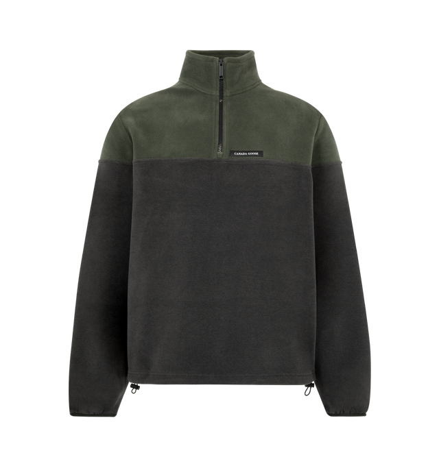Image 1 of 2 - GREEN - Canada Goose Men's Loma Fleece Half Zip is crafted from Italian-made poly cotton fleece with a brushed face for a soft, comfortable feel against the skin. Designed as a versatile layering piece, this half-zip fleece features a two-layer collar, elasticated cuffs, and an adjustable hem with a shock cord for a customizable fit. Main Material: 58% Polyester, 42% Cotton. Fabric: Poly Cotton Fleece. Details: Two-Layer Collar, Elasticated Cuffs, Adjustable Shock-Cord Hem. Fabric Made in Ita 
