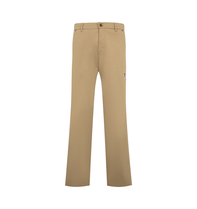 Image 1 of 1 - NEUTRAL - Moncler Men's Stretch Gabardine Pants are crafted from stretch cotton gabardine and reinterpret utilitarian workwear with a structured feel and functional detailing. Designed with an elasticated drawstring waistband with metal tips, these designer pants feature a zipper and button fastening, side pockets, back pockets, a side zipper pocket, and a signature Moncler logo patch. Main Material: 97% Cotton, 3% Elastane/Spandex. Waist: Elasticated with Drawstring. Closure: Zipper and Butt 