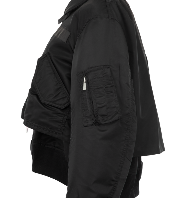 Image 3 of 4 - BLACK - Sacai Nylon Twill Blouson is crafted from nylon twill with lightweight padding. Features a blouson silhouette, mixed-media paneling, full lining, and modern utility-inspired construction. Outer: 100% Nylon; Parts: 55% Polyester, 44% Cotton, 1% Polyurethane; Lining: 100% Polyester; Filling: 100% Polyester. Made in Japan. 