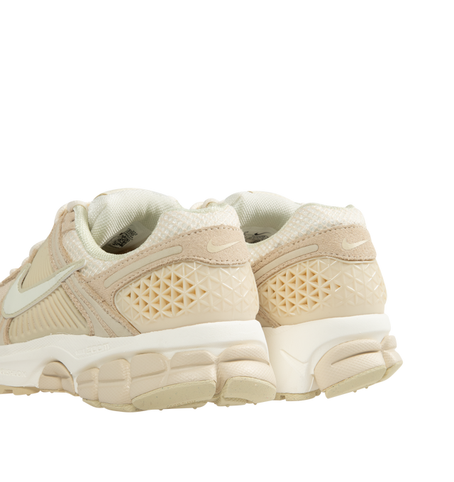 Image 3 of 5 - NEUTRAL - Nike Zoom Vomero 5 Sneakers are a lace-up style with real and synthetic leather uppers, mesh panels, ventilation ports, Zoom Air cushioning, plastic caging at the dies, and rubber outsoles.  