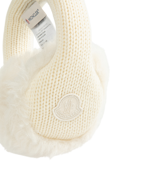 Image 2 of 2 - CREAM - Moncler Ribbed-Knit Furry Earmuffs feature a cream-colored, padded headband wrapped in 100% virgin wool alongside plush, tactile faux-fur 100% polyester ear warmers. 
