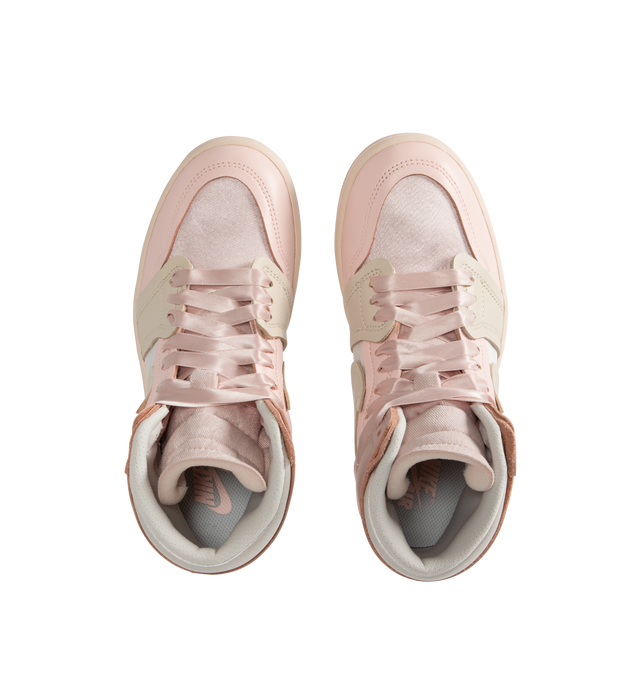 Image 5 of 5 - PINK - Women's Air Jordan 1 Method Of Make high top sneakers in Pink Oxford, Legend Light Brown, Atmosphere colorway inspired by pointe shoes playing with textures and proportions with satin details and exaggerated proportions including a larger Swoosh for a distinctive look. 