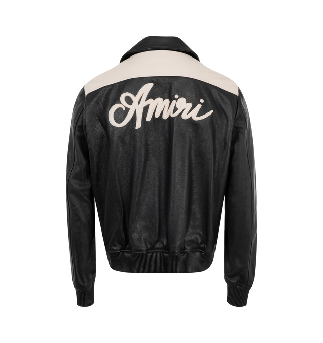 Image 2 of 3 - BLACK - AMIRI MA Swirl Leather Jacket featuring two-tone leather, point collar, center snap closure, MA swirl logo at chest, logo script on back, welt zipper pockets and ribbed cuffs and waistband. Made in Italy. 