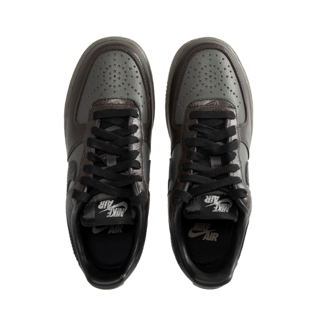 Image 5 of 5 - BLACK - Nike Air Force 1 Low lace-up sneakers in a Black Tea and Petra Brown color combo. Features Nike Air cushioning, low-cut silhouette, padded collar, foam midsole, perforations on toe and rubber outsole. 