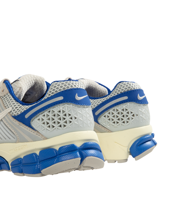 Image 3 of 5 - BLUE - NIKE Zoom Vomero 5 Sneaker featuring real and synthetic leather on upper, mesh panels and ventilation ports on heel, Air Zoom cushioning, plastic caging on side, rubber outsole and reflective details. 