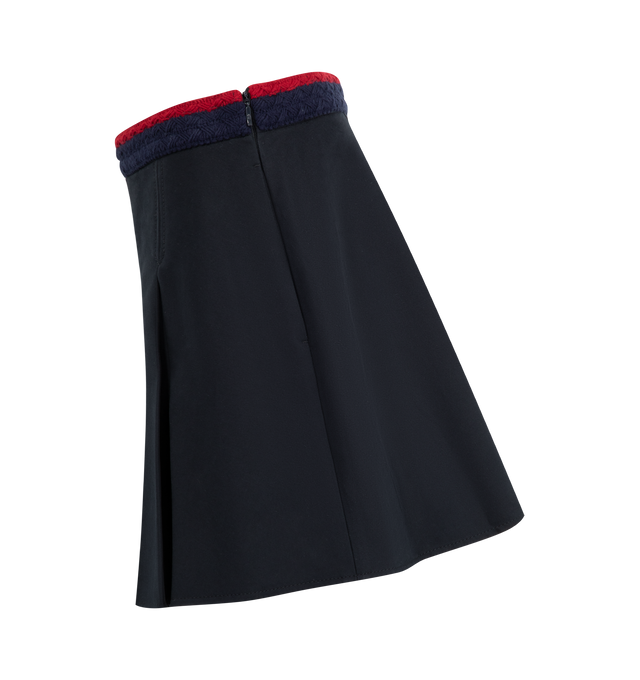 Image 4 of 4 - NAVY - MONCLER Pleated Mini Skirt featuring stretch cotton gabardine, striped braided waistband, side zipper closure and pleated. 98% cotton, 2% elastane/spandex. 