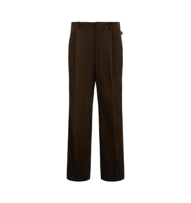 Image 1 of 3 - BROWN - Kaptain Sunshine Corduroy Mud-Dyed Shoecut Slacks are crafted from high-density cotton corduroy woven with yarns of varying counts and feature a relaxed-fit silhouette, a mid-rise waist, two front pleats, and side buckle adjusters. Dyed using an artisanal mud-dyeing process that utilizes iron-rich mud from Japan's Kyushu region, the trousers develop a rich Natural Dark Mud color through repeated dyeing and washing by skilled craftspeople. Designed with a subtle shoecut leg shape, this 