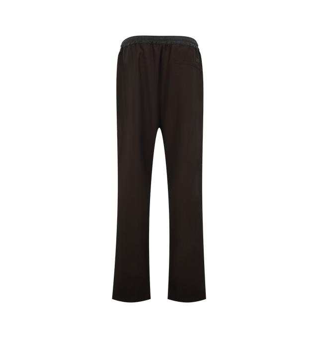Image 2 of 3 - BROWN - Wales Bonner Men's Energy Trouser is crafted from crespo wool and silk and features a refined tailored silhouette with a concealed drawstring elasticized waistband for elevated comfort. Detailed with front pleats, slip pockets, contrast ribbing along the side legs, and an embroidered WB logo at the back, these trousers balance classic tailoring with the brand's distinctive sportswear influences. Main Material: 100% Virgin Wool. Trim 1: 100% Silk. Trim 2: 100% Polyester. Pocket Lining: 