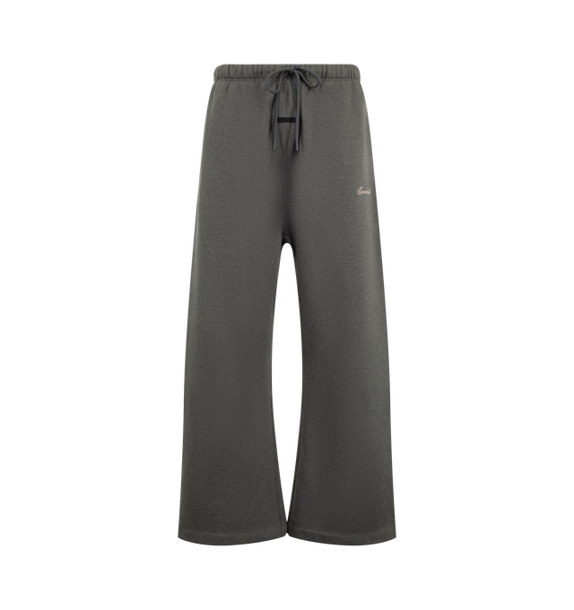 Image 1 of 3 - GREY - Fear of God ESSENTIALS Men's Signature Flare Sweatpant is crafted from heavyweight 380 GSM cotton-blend fleece and features a relaxed-fit silhouette that extends into a flared leg. Designed with the Essentials signature logo embroidered at the leg, this elevated loungewear style is finished with an encased elastic waistband, elongated drawcords, side-seam pockets, and a signature Essentials label at the center front. Main Material: 80% Cotton, 20% Polyester, 380 GSM.  