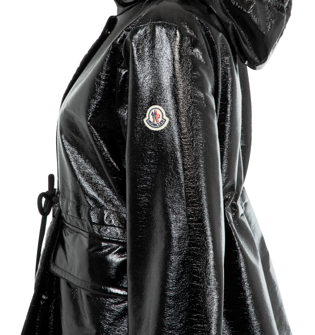 Image 3 of 3 - BLACK - Moncler Agnou Short Shiny Parka has a stand collar, front zip closure, snap placket, fixed hood, adjustable snap cuffs, front flap patch pockets, and drawcord waist. Lined. 89% polyester, 8% cotton, 3% other fibers. Made in Hungary.  