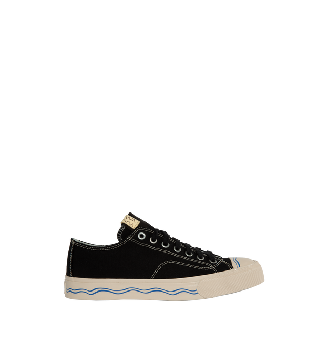Image 1 of 5 - BLACK - VISVIM Seeger Lo sneaker crafted from Japanese high twist cotton canvas upper, Vibram non-replaceable outsole, pigment free leather lining, cork insole for enhanced cushioning and moisture absorption. The sizing and fit can vary depending on the style of shoe and its design along with the material used for its construction. Please be aware that the natural leather hides have been specially treated to create a unique texture which creates wrinkles and variation in size, expression, and 